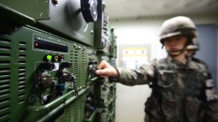 a South Korean soldier turns on speakers blasting K-pop in Korea's DMZ