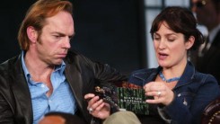  Hugo Weaving and Carrie-Anne Moss look at the soundtrack for The Matrix during a visit from the cast of 'The Matrix Reloaded' on MTV's Total Request Live May 13, 2003 at the MTV Times Square studios in New York City.