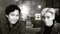 Choi Seung-Hyun (T.O.P) takes picture together with the acclaimed actor Lee Jung-Jae.