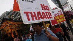 Protesters attend the rally to denounce deploying the Terminal High-Altitude Area Defense (THAAD) near the U.S. embassy on July 13, 2016 in Seoul, South Korea. 