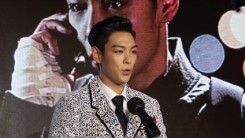  T.O.P of Bigbang award a Rookie prize at Asia Star Awards during the 18th Busan International Film Festival on October 5, 2013 in Busan, South Korea.