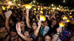 Fans of Korean Pop Band Bigbang watch as they perform at the Singapore Formula 1 Grand Prix on September 20, 2013 in Singapore.