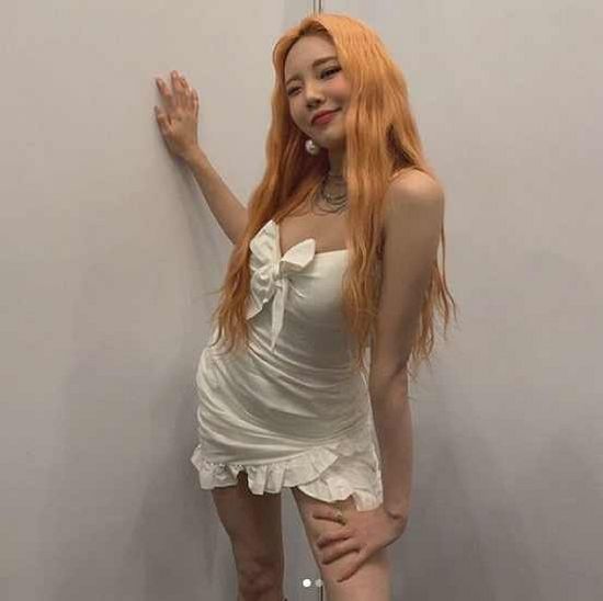 Momoland JooE, poses in a mini dress
