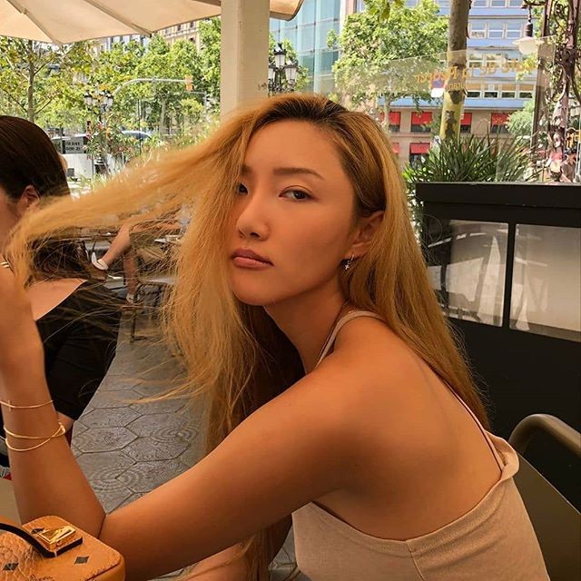 MAMAMOO's Hwasa Slays on The Beach in a White One-Piece