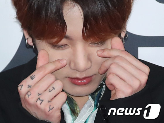 BTS: Jungkook Gets Friendship Tattoo Behind Ear, Reveals Full Sleeve, V  Gets His '7' Between Moles on Arm - News18