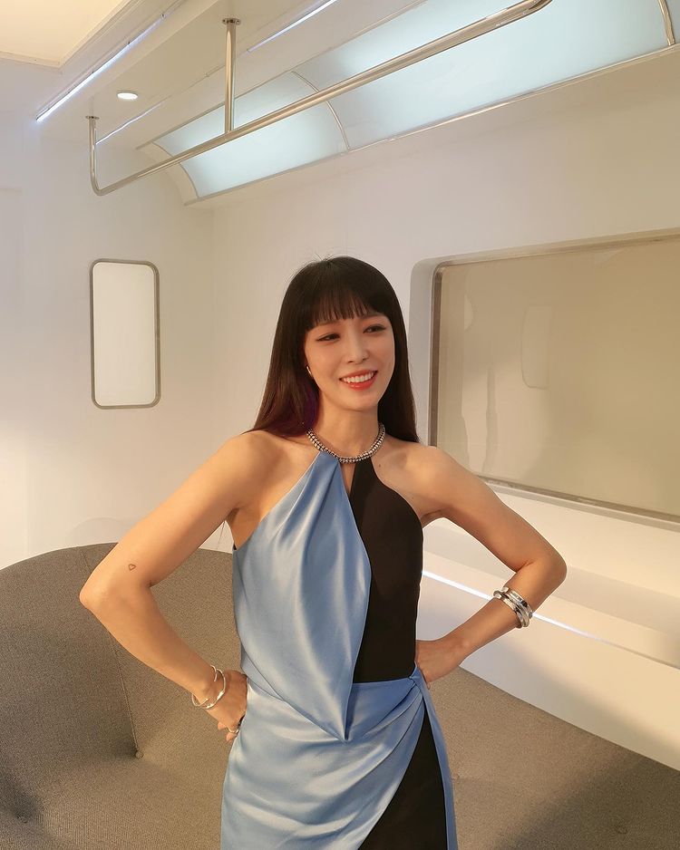 BoA, delicate clavicle + forearm line… Sexy with a halterneck dress