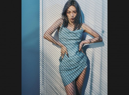 Taeyeon radiates sexy beauty in slips under blue lights