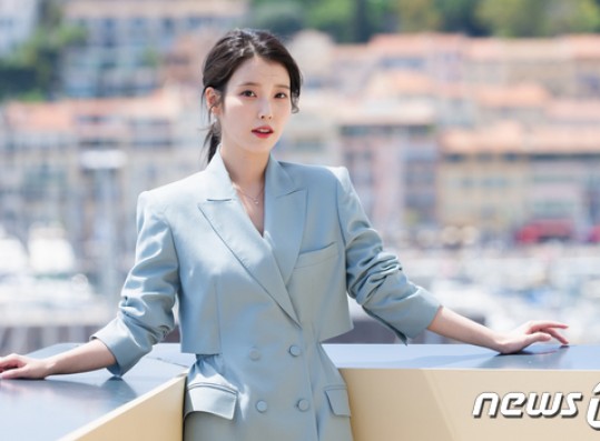 IU shooting with Cannes Beach in the background