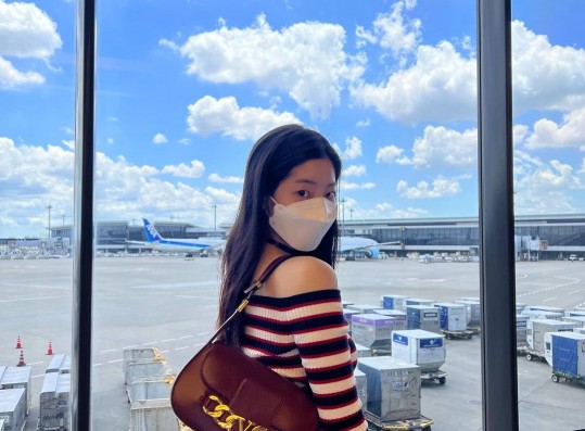 TWICE Dahyun, airport look showing her slender shoulders