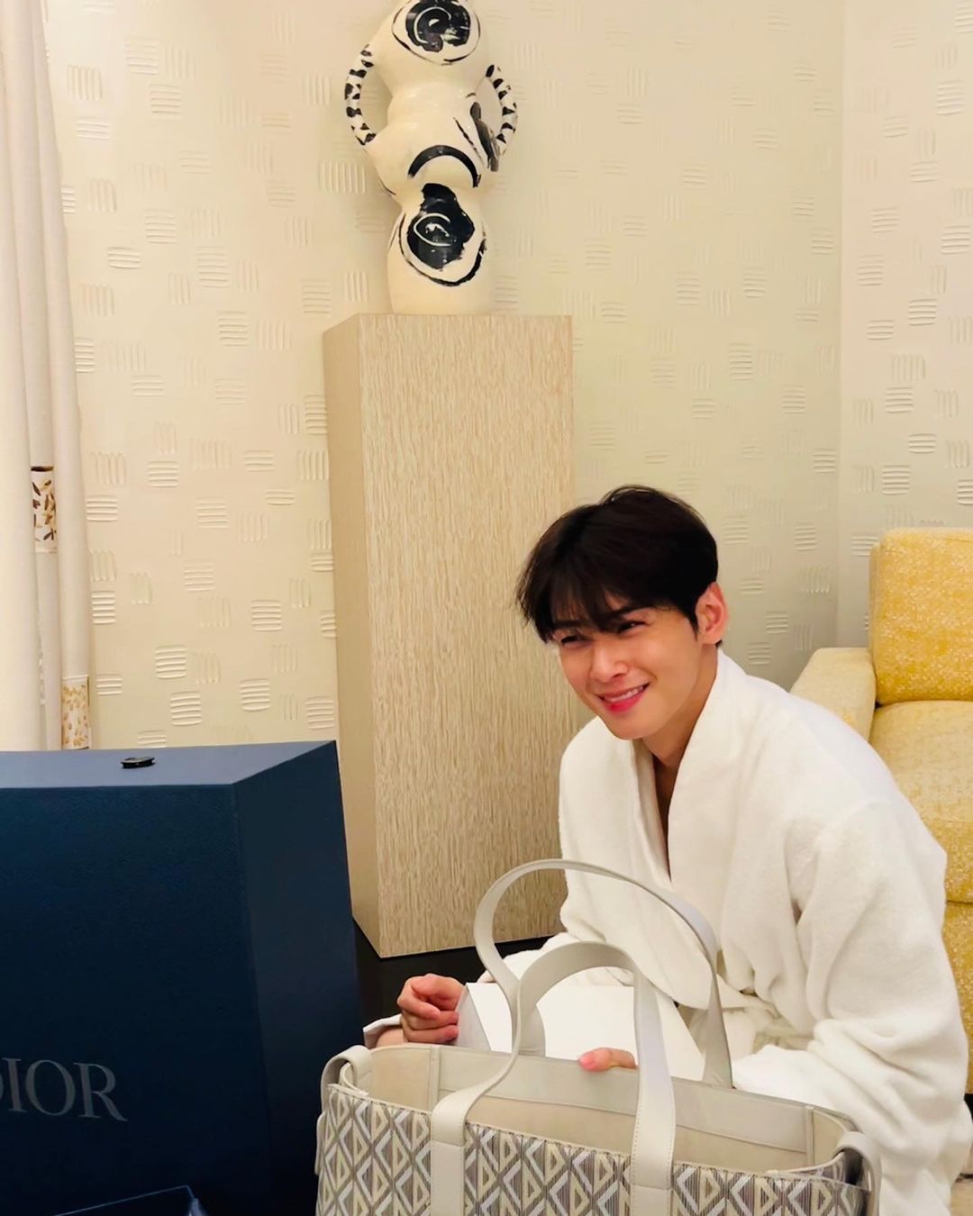 Cha Eun-woo, wearing a shower robe and smiling brightly