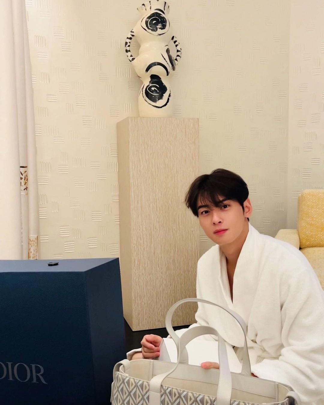 Cha Eun-woo, wearing a shower robe and smiling brightly