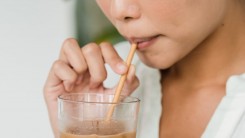 girl sipping coffee with straw